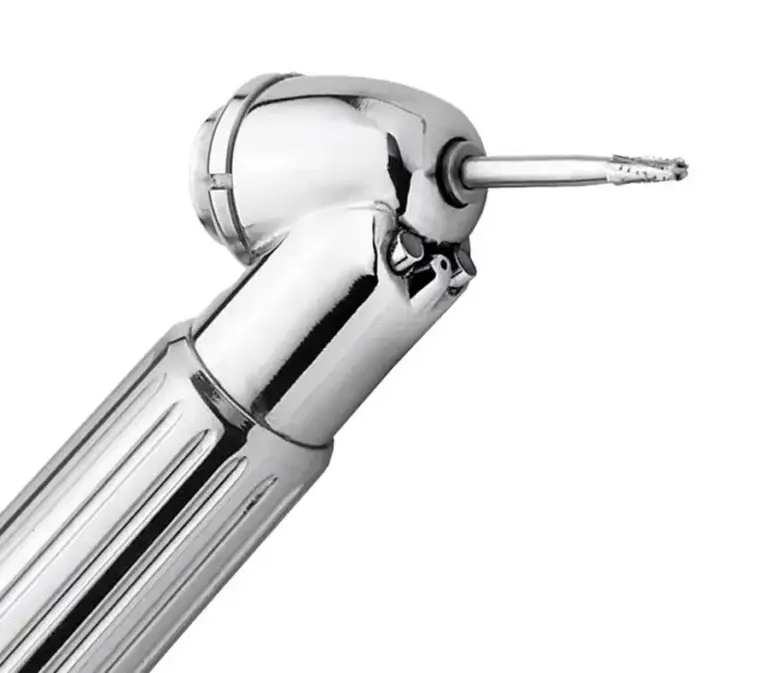 Close-up of an Impact Air 45 handpiece head with a surgical bur seated, showing the 45 degree angle used for third molar and surgical extractions